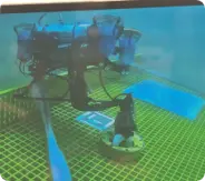 Photo showing our robosub manipulating a valve underwater.